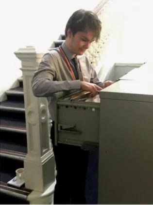 Clerical Administrator filing papers